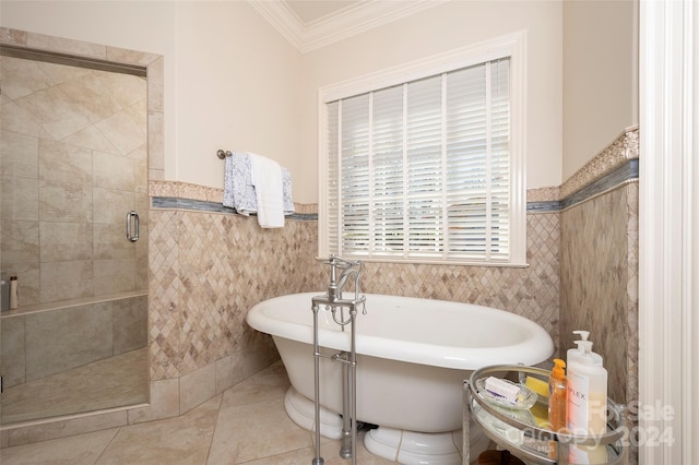 bathroom with tile patterned flooring, separate shower and tub, tile walls, and crown molding