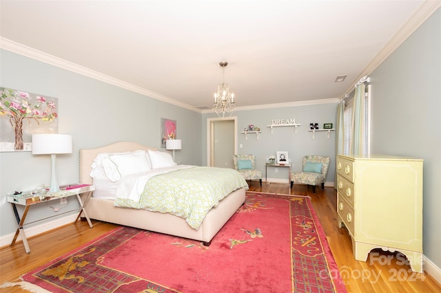 bedroom with dark hardwood / wood-style floors, an inviting chandelier, and crown molding