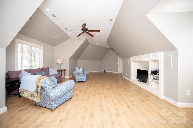 living room with light wood-type flooring, vaulted ceiling, and ceiling fan