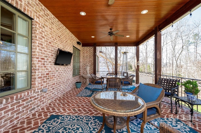 view of patio / terrace featuring ceiling fan and an outdoor living space