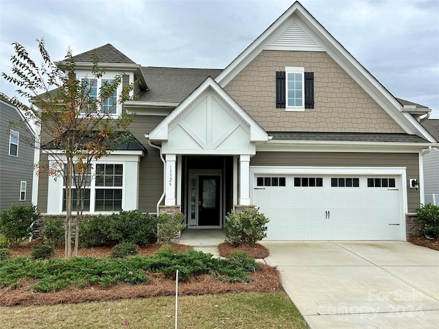 craftsman-style home with a garage