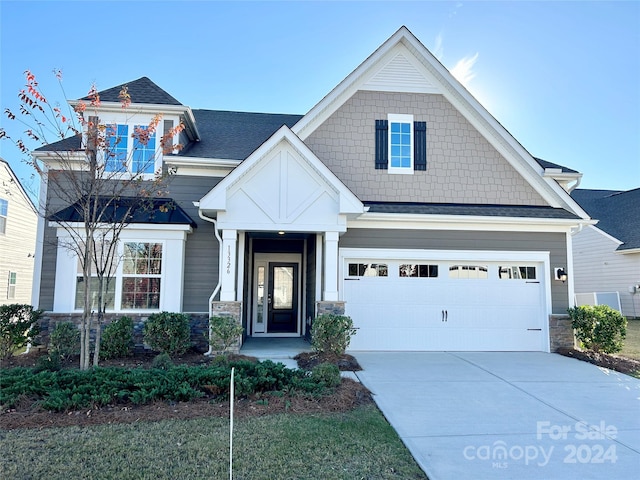 craftsman-style home featuring a garage