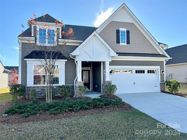 craftsman-style home with a garage