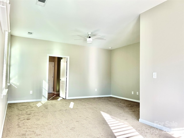 unfurnished room featuring carpet flooring and ceiling fan