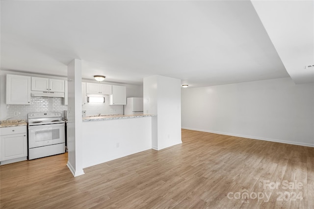 kitchen with white cabinets, light wood-type flooring, white appliances, and tasteful backsplash