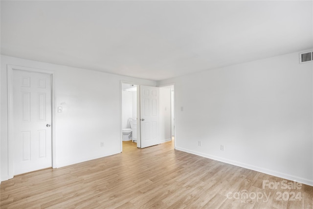 spare room with light wood-type flooring