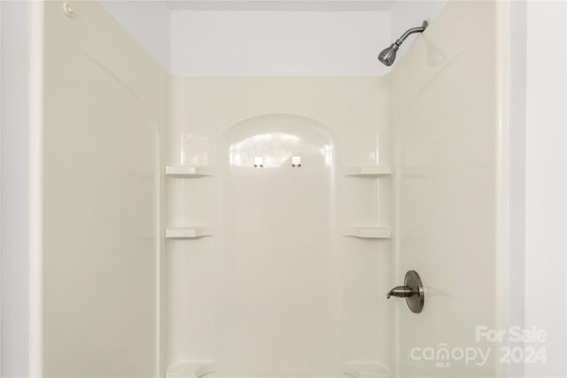 bathroom featuring walk in shower