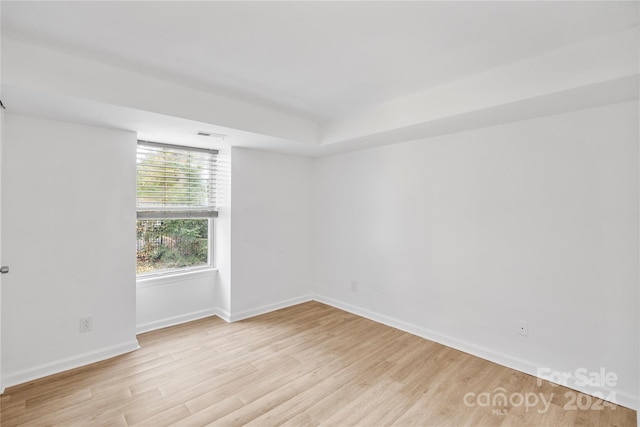 unfurnished room with light hardwood / wood-style floors