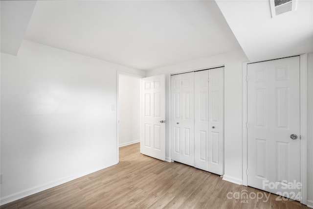 unfurnished bedroom with light hardwood / wood-style flooring