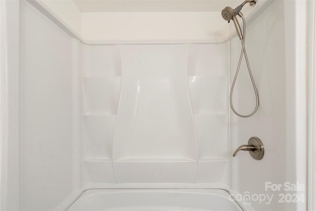 bathroom with shower / tub combination