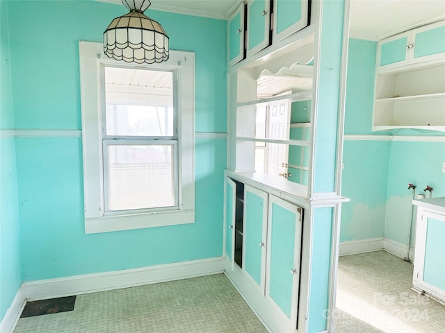 interior space with crown molding