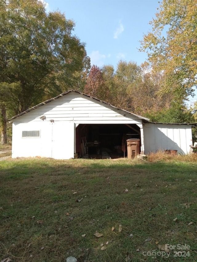 garage with a yard