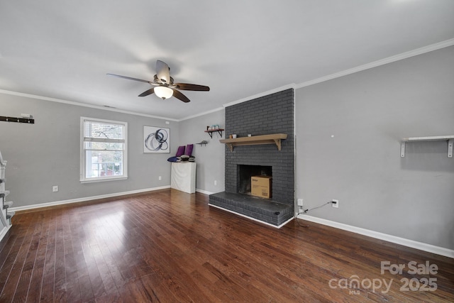 unfurnished living room featuring crown molding, a fireplace, dark hardwood / wood-style floors, and ceiling fan