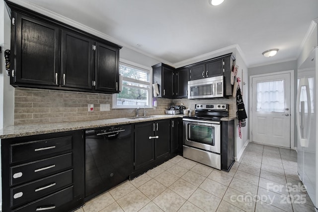 kitchen with sink, backsplash, light tile patterned floors, stainless steel appliances, and crown molding