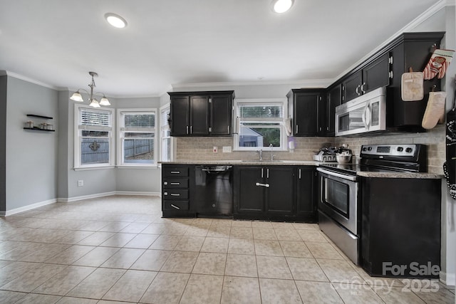 kitchen featuring decorative light fixtures, tasteful backsplash, ornamental molding, light tile patterned floors, and stainless steel appliances