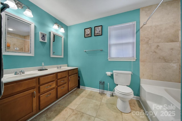 full bathroom featuring tiled shower / bath, tile patterned floors, toilet, and vanity