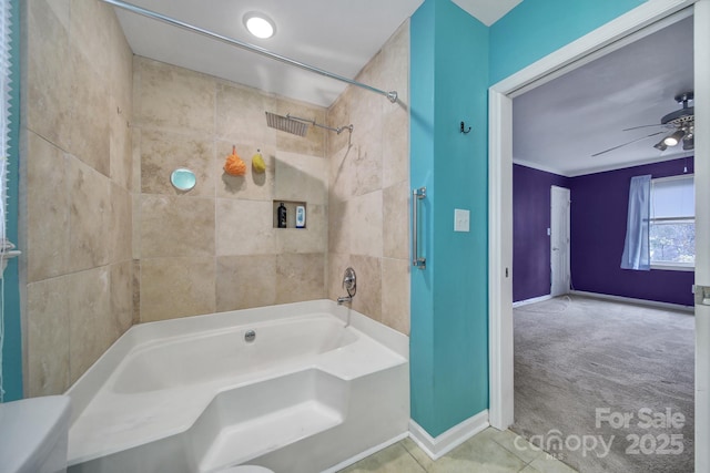 bathroom featuring tiled shower / bath and ceiling fan