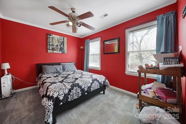 carpeted bedroom featuring ceiling fan and ornamental molding