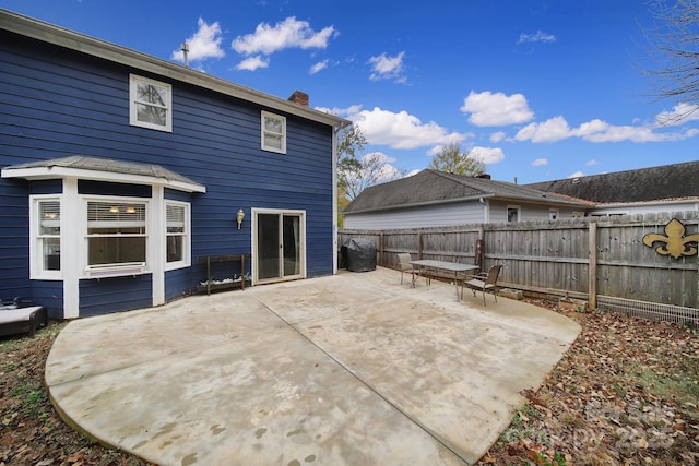 back of property featuring a patio