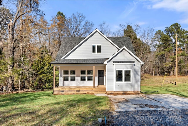 view of front of home featuring covered porch and a front yard