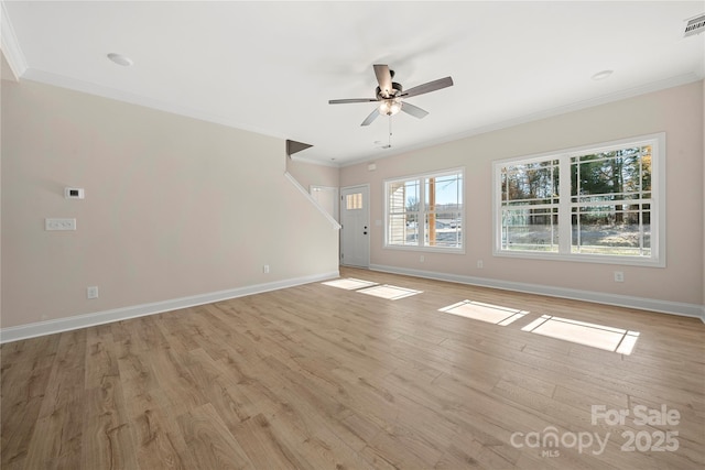 unfurnished living room with baseboards, ceiling fan, ornamental molding, and light wood-style floors