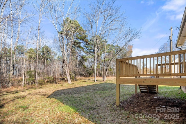 view of yard featuring a wooden deck