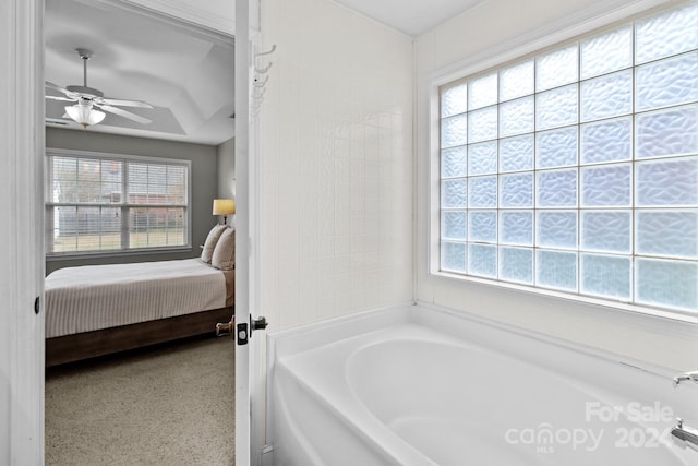 bathroom with a washtub and ceiling fan