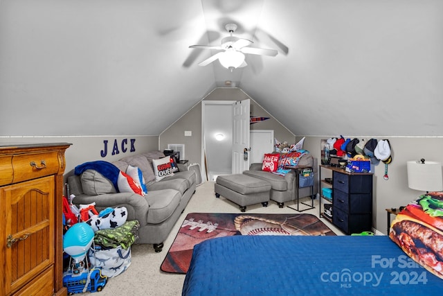 carpeted bedroom with vaulted ceiling and ceiling fan