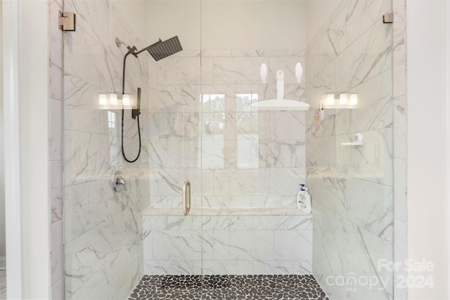 bathroom featuring an enclosed shower