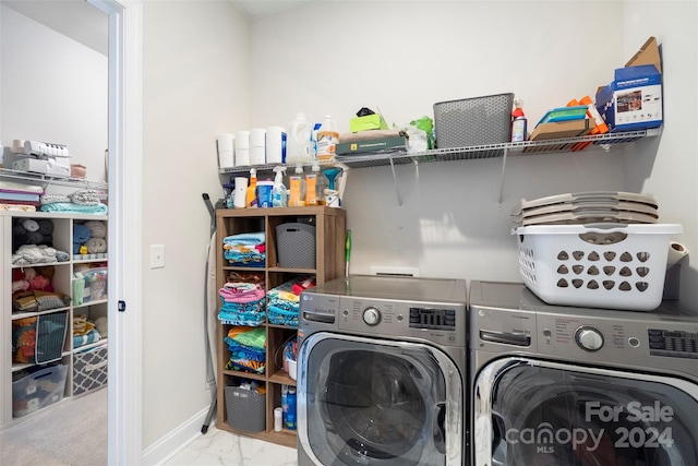 laundry area featuring independent washer and dryer and light colored carpet