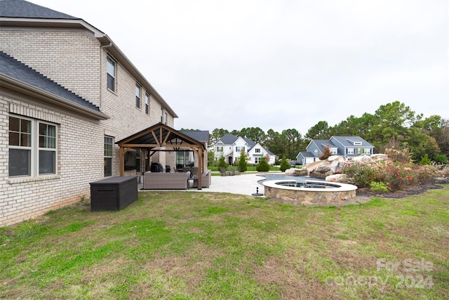 view of yard featuring a gazebo, a patio area, outdoor lounge area, and a hot tub