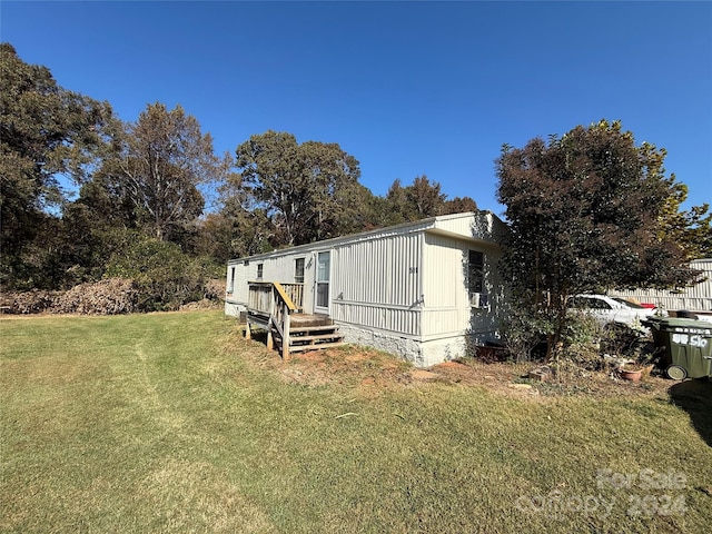 view of property exterior with a yard