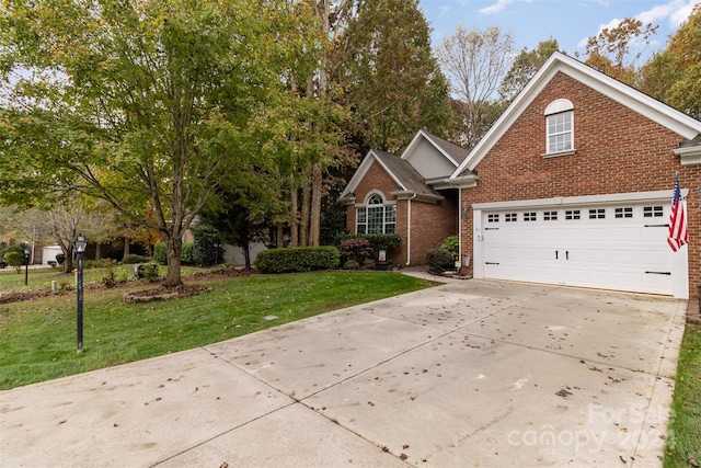 view of front property with a front lawn and a garage