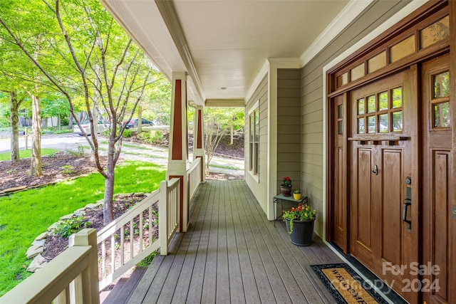 wooden terrace with covered porch