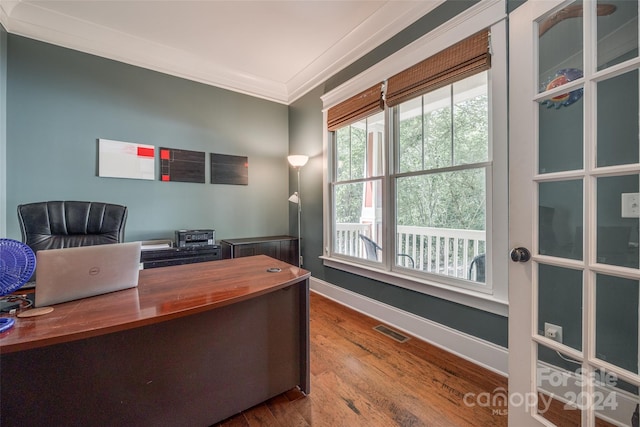 office space featuring hardwood / wood-style floors and crown molding