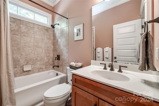 full bathroom featuring vanity, toilet, crown molding, and shower / bath combo