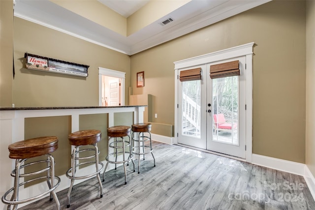 interior space with light hardwood / wood-style flooring and french doors