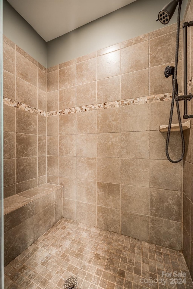 bathroom with tiled shower