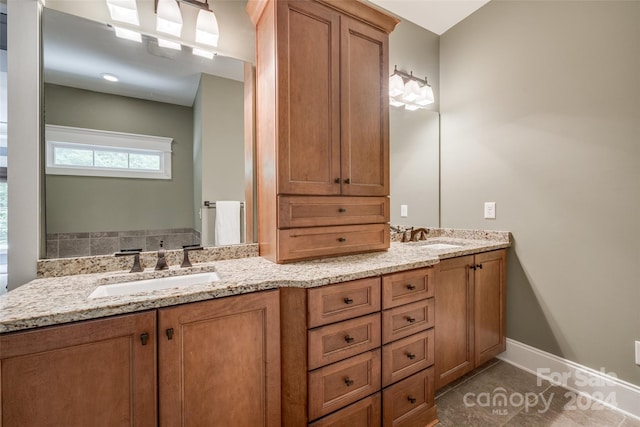 bathroom with vanity and tile patterned flooring