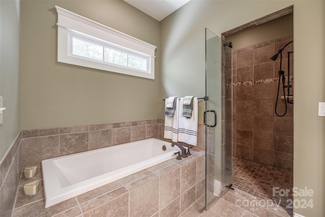 bathroom featuring plus walk in shower