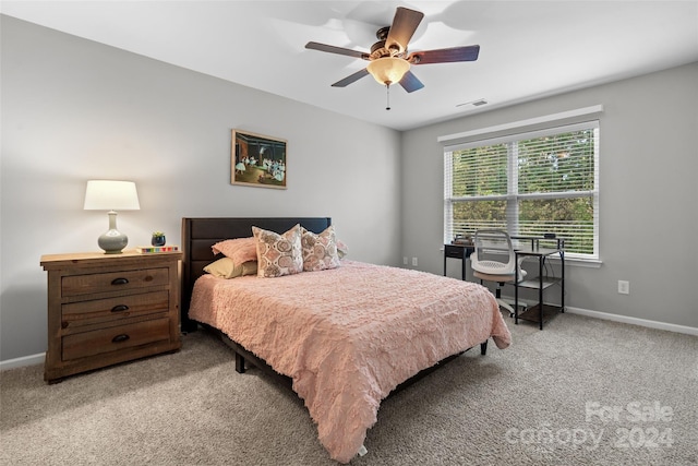 carpeted bedroom featuring ceiling fan