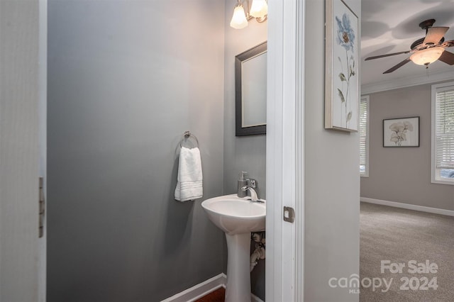 bathroom featuring ceiling fan and ornamental molding