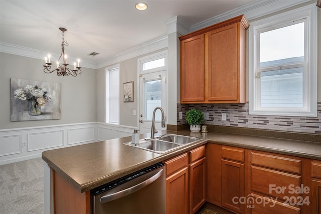 kitchen with kitchen peninsula, sink, crown molding, stainless steel dishwasher, and tasteful backsplash