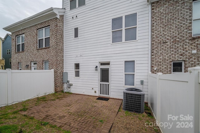 back of property featuring a patio and cooling unit