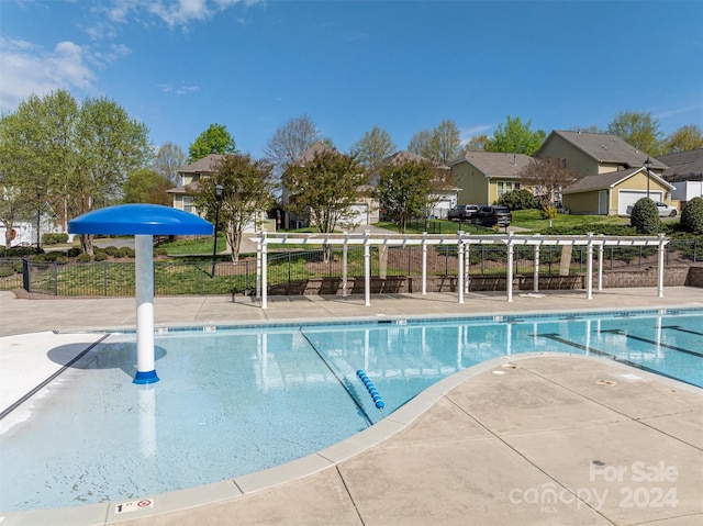 view of swimming pool with a patio