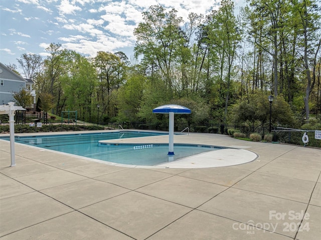 view of pool with a patio area