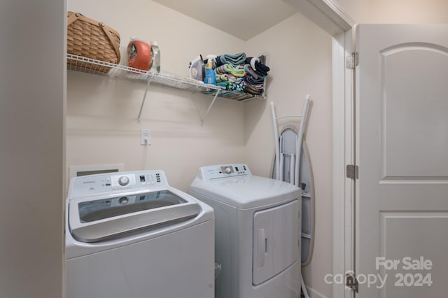 laundry area featuring washing machine and dryer