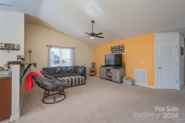 living room with sink, vaulted ceiling, light colored carpet, and ceiling fan