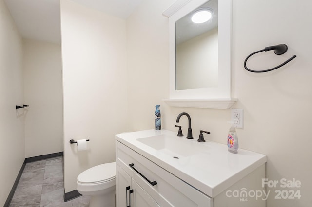 201 Mccubbins St, Salisbury, NC 28144 - bathroom with toilet, baseboards, marble finish floor, and vanity
