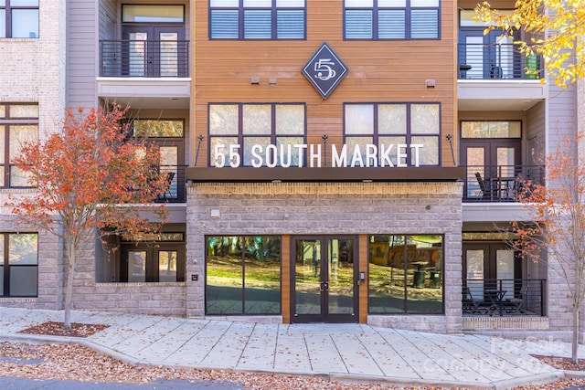 view of exterior entry featuring french doors